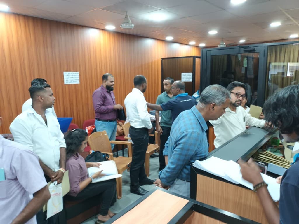 Clients waiting and submitting documents at New Asian Travels office